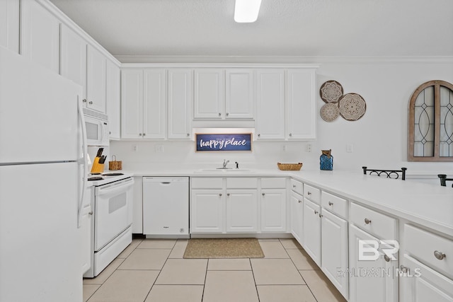 kitchen featuring light tile floors, white appliances, white cabinetry, and crown molding