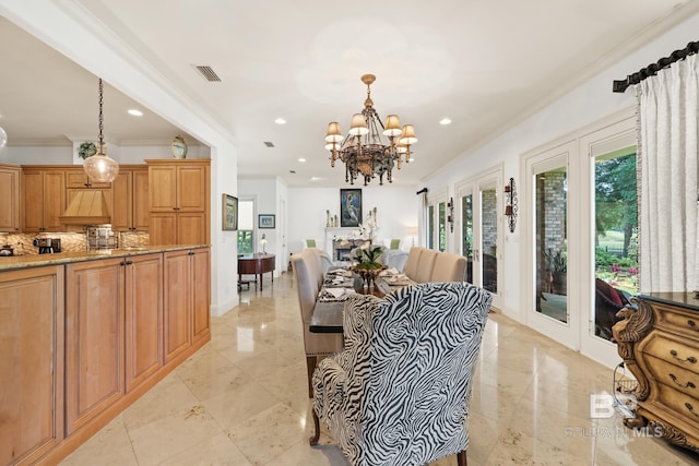 interior space with crown molding, an inviting chandelier, and light tile floors