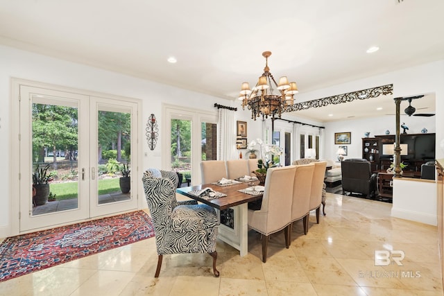 tiled dining area featuring ornamental molding, a notable chandelier, and french doors