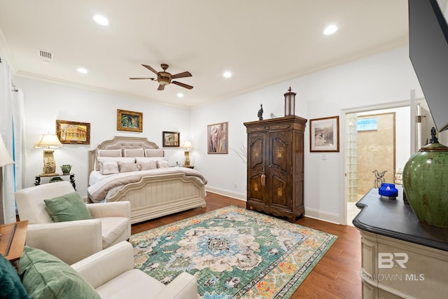 bedroom with crown molding, ceiling fan, and dark hardwood / wood-style floors