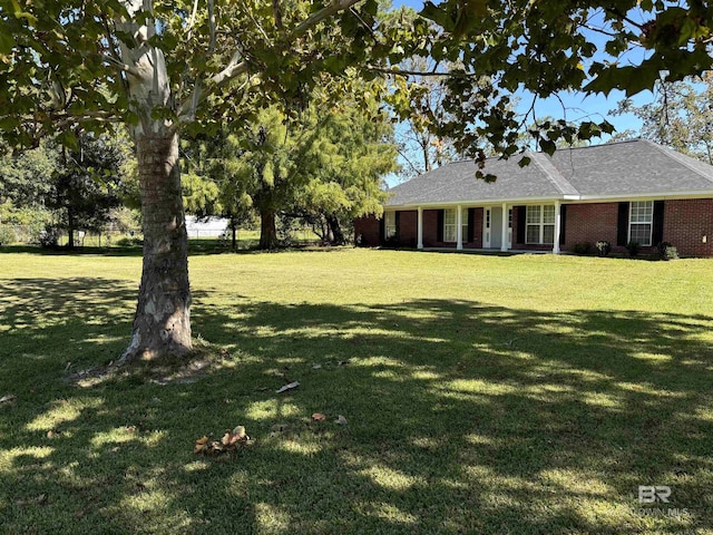14313 Hemley Rd, Coden, AL 36523 - view of grassy yard with covered porch