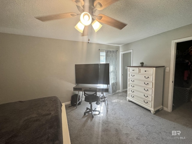 14313 Hemley Rd, Coden, AL 36523 - bedroom featuring carpet flooring, a textured ceiling, baseboards, and ceiling fan