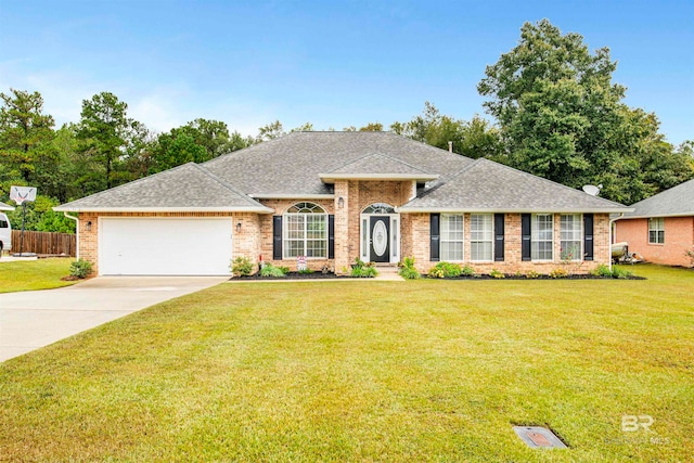 ranch-style house featuring a front lawn and a garage