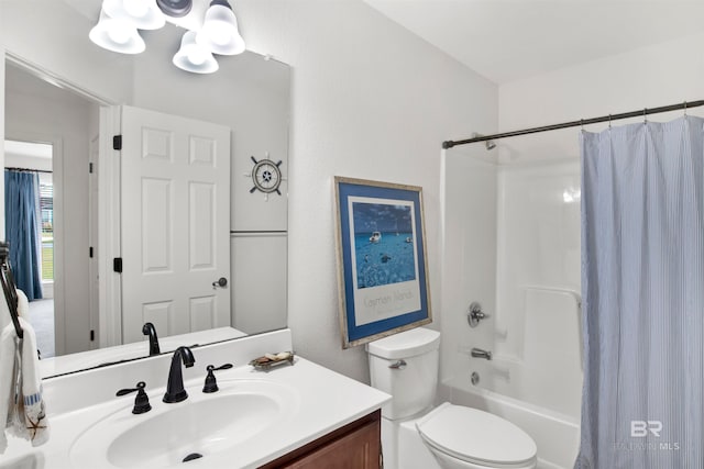 full bathroom featuring shower / bath combination with curtain, toilet, a notable chandelier, and vanity