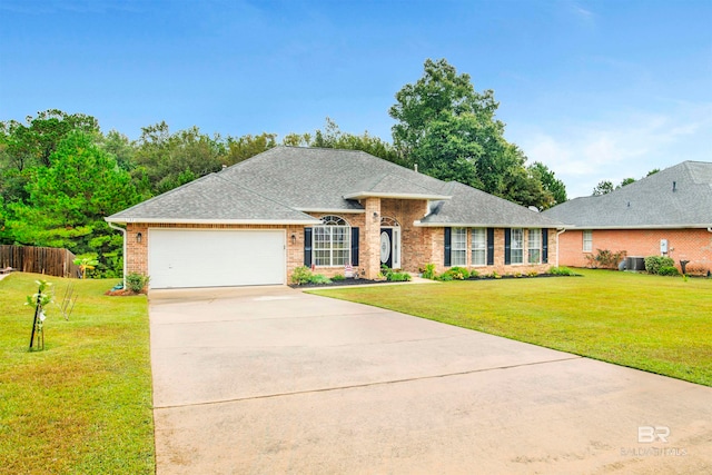 ranch-style house with a front yard and a garage