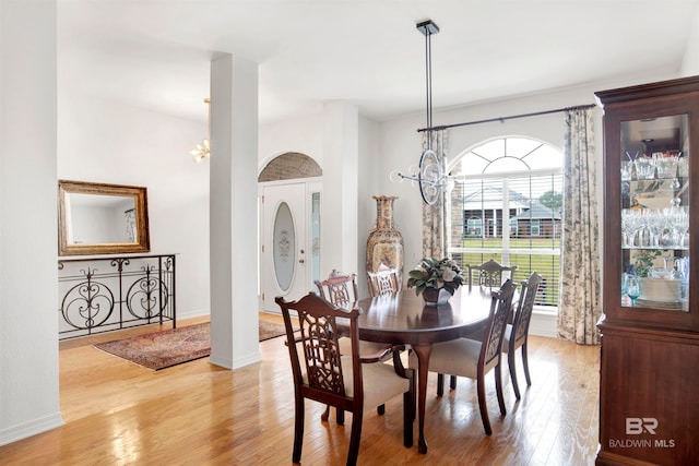 dining room featuring a notable chandelier and light hardwood / wood-style floors