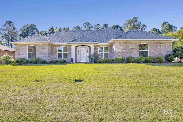 ranch-style home featuring a front yard