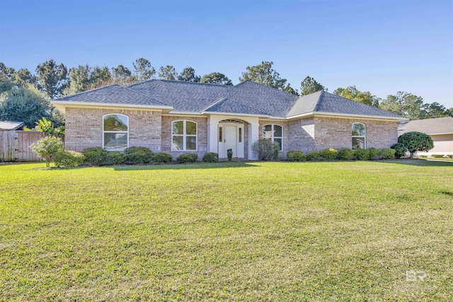 ranch-style house featuring a front lawn