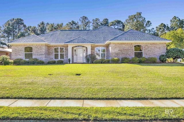 ranch-style home with a front lawn