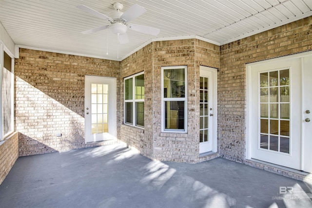 exterior space featuring ceiling fan and a patio area