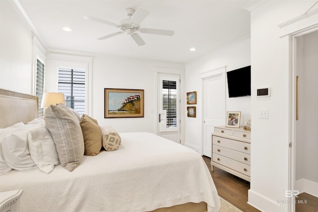 bedroom featuring ornamental molding, dark hardwood / wood-style floors, and ceiling fan