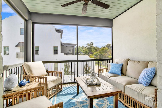 sunroom / solarium featuring wood ceiling and ceiling fan