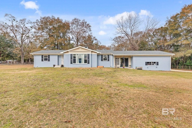 ranch-style home with a front lawn