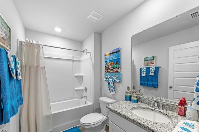 full bathroom featuring vanity, shower / bath combo, and toilet