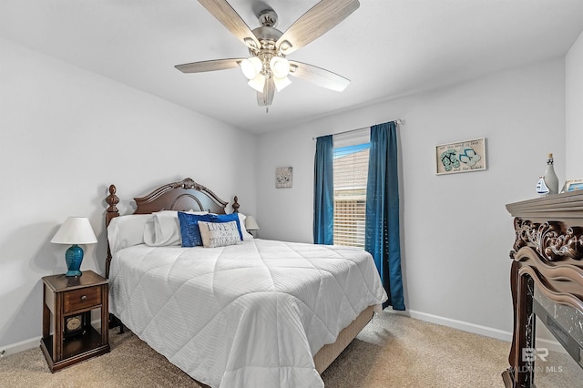 bedroom featuring ceiling fan and light carpet