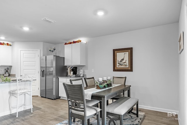 dining room featuring light wood-type flooring