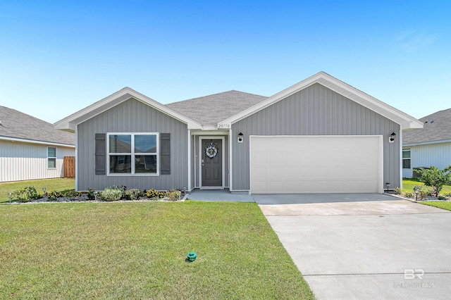 ranch-style home featuring a garage and a front yard