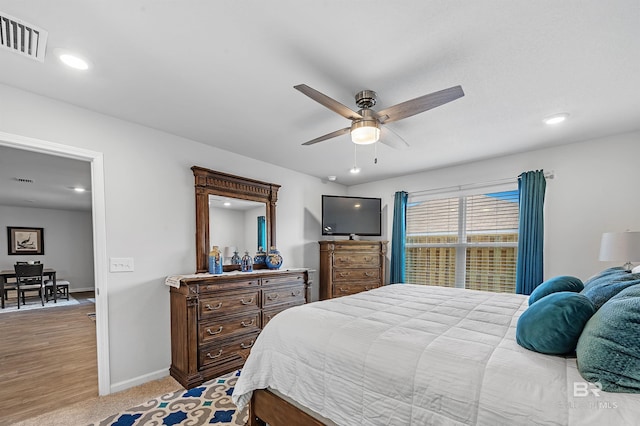 bedroom featuring ceiling fan and wood-type flooring