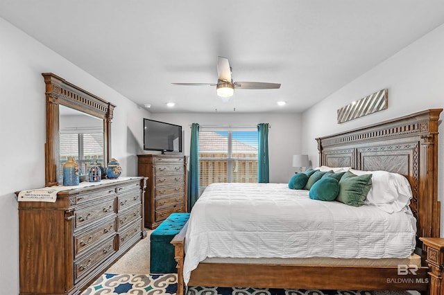 carpeted bedroom with ceiling fan