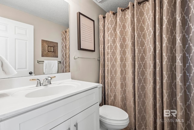 527 Beach Club Trl Unit C908, Gulf Shores, AL 36542 - bathroom featuring vanity, a textured ceiling, and toilet