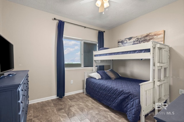 527 Beach Club Trl Unit C908, Gulf Shores, AL 36542 - bedroom featuring baseboards, a textured ceiling, and ceiling fan