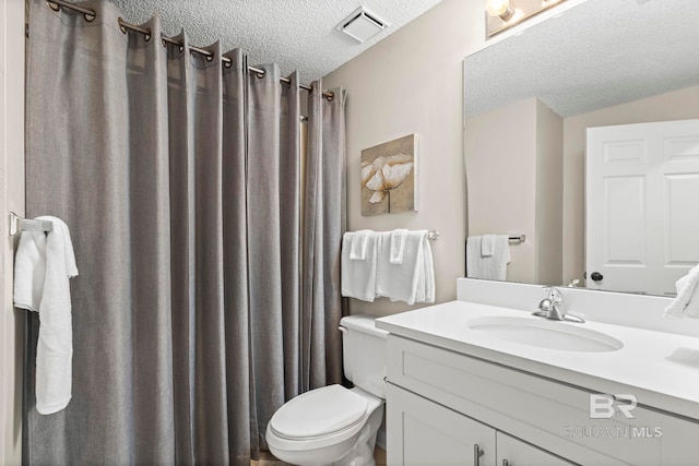 527 Beach Club Trl Unit C908, Gulf Shores, AL 36542 - full bath with toilet, a textured ceiling, visible vents, and vanity