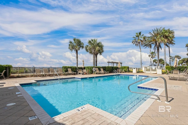 527 Beach Club Trl Unit C908, Gulf Shores, AL 36542 - community pool with a patio area and fence