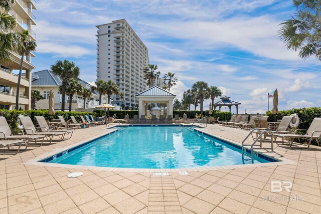 527 Beach Club Trl Unit C908, Gulf Shores, AL 36542 - community pool with a gazebo and a patio area