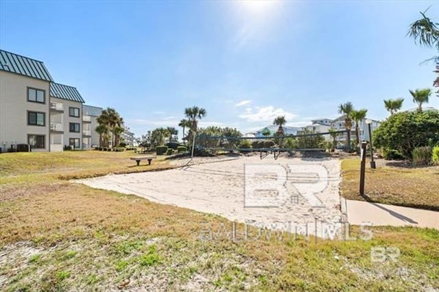 surrounding community with volleyball court and a yard