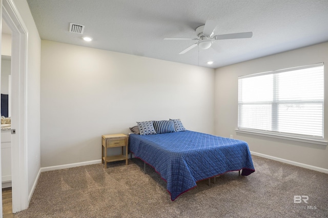 bedroom featuring carpet flooring, visible vents, and baseboards