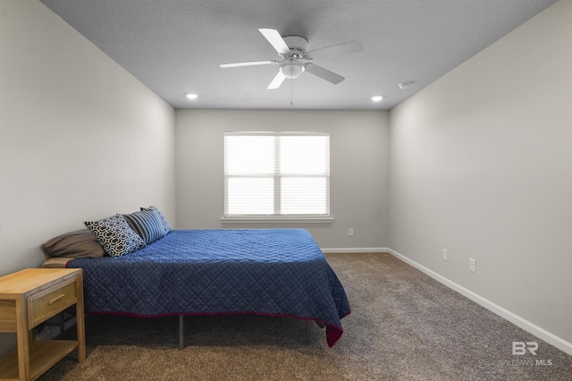 bedroom with carpet flooring, ceiling fan, a textured ceiling, and baseboards