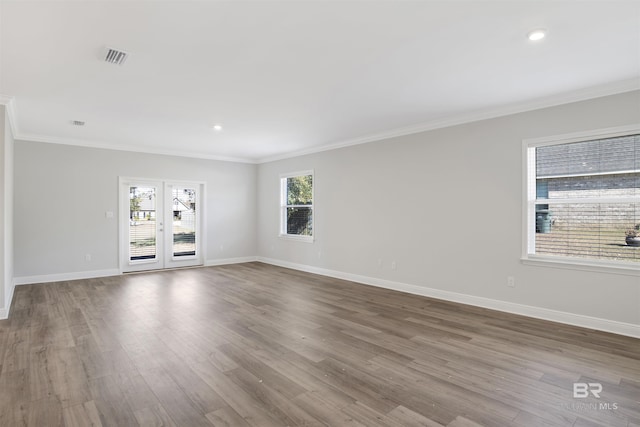 1061 Tampa Ave, Foley, AL 36535 - empty room with crown molding, baseboards, wood finished floors, and recessed lighting
