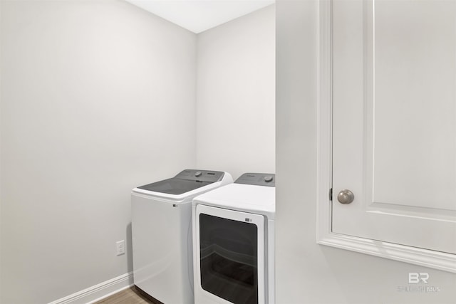 1061 Tampa Ave, Foley, AL 36535 - washroom featuring washing machine and clothes dryer and baseboards