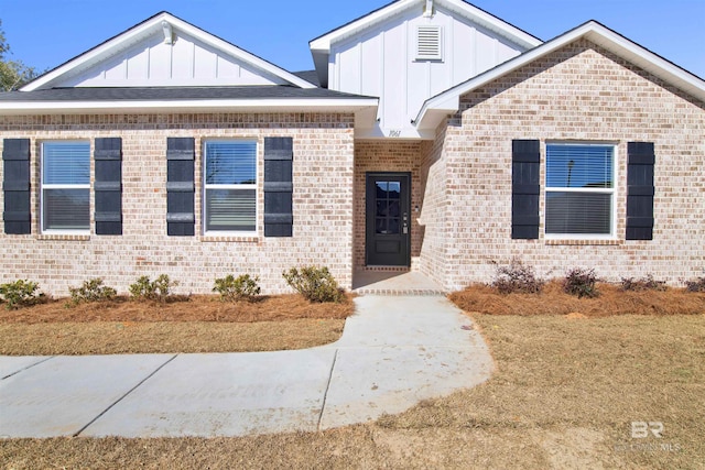 1061 Tampa Ave, Foley, AL 36535 - view of front of house featuring board and batten siding and brick siding