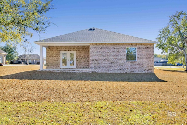 1061 Tampa Ave, Foley, AL 36535 - back of house with brick siding, a shingled roof, and french doors