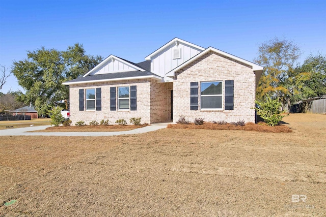 1061 Tampa Ave, Foley, AL 36535 - craftsman house featuring board and batten siding, brick siding, and a front yard
