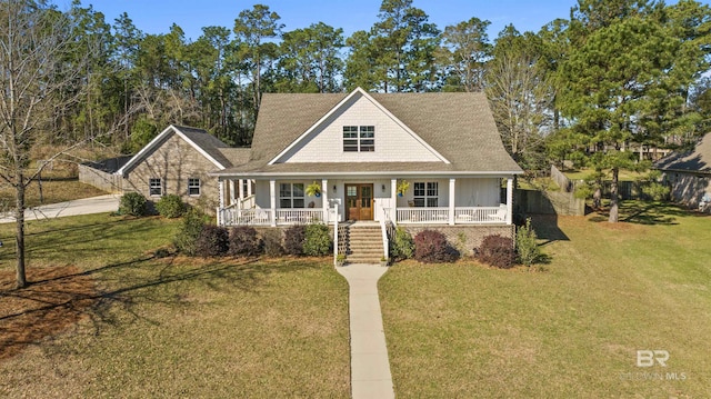 farmhouse with a porch and a front yard