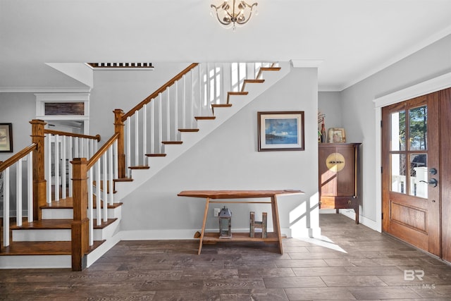 entrance foyer with baseboards, wood finished floors, and ornamental molding