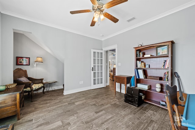 home office featuring visible vents, a ceiling fan, wood finished floors, and crown molding