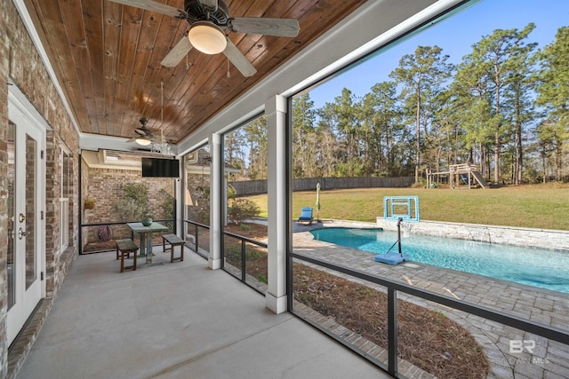 unfurnished sunroom featuring ceiling fan and wooden ceiling