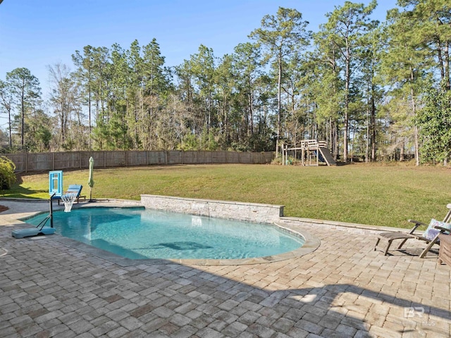 view of swimming pool with a yard, a fenced backyard, a playground, and a patio