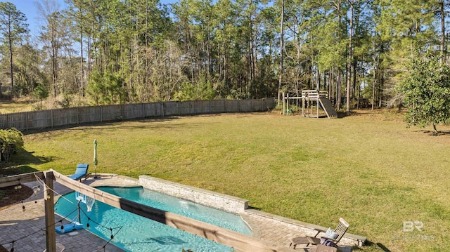 view of yard featuring a playground, fence, and a fenced in pool