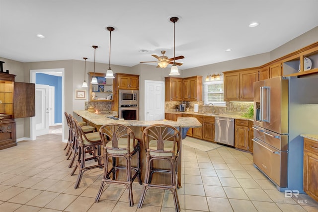 kitchen featuring open shelves, appliances with stainless steel finishes, and light tile patterned floors