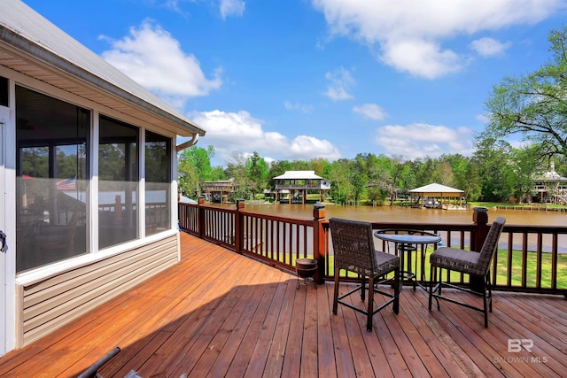wooden deck with a water view