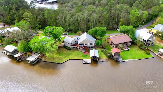 bird's eye view with a water view and a forest view
