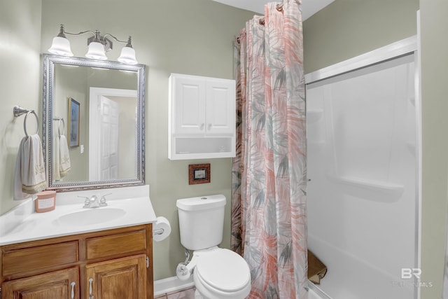 bathroom with vanity, toilet, and a shower with curtain