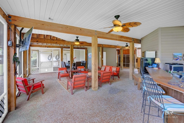 exterior space featuring exterior bar, a ceiling fan, and outdoor lounge area
