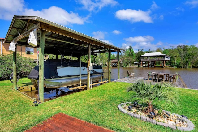 dock area with boat lift, a water view, and a yard