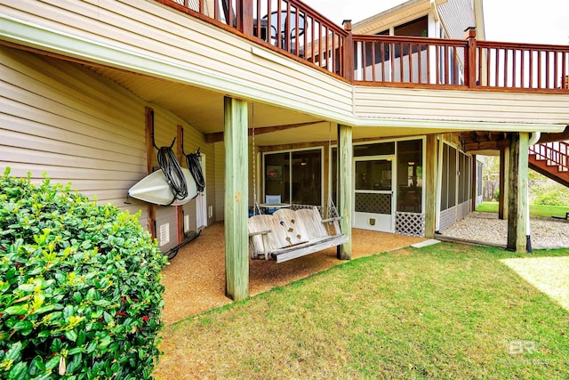 back of house with a lawn