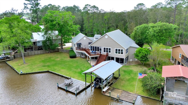 birds eye view of property with a water view and a forest view
